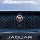 The grill of a Jaguar SUV with COP26 branding.